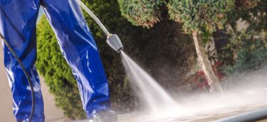 Men Washing Garden Residential Brick Paths with Professional Pressure Washer